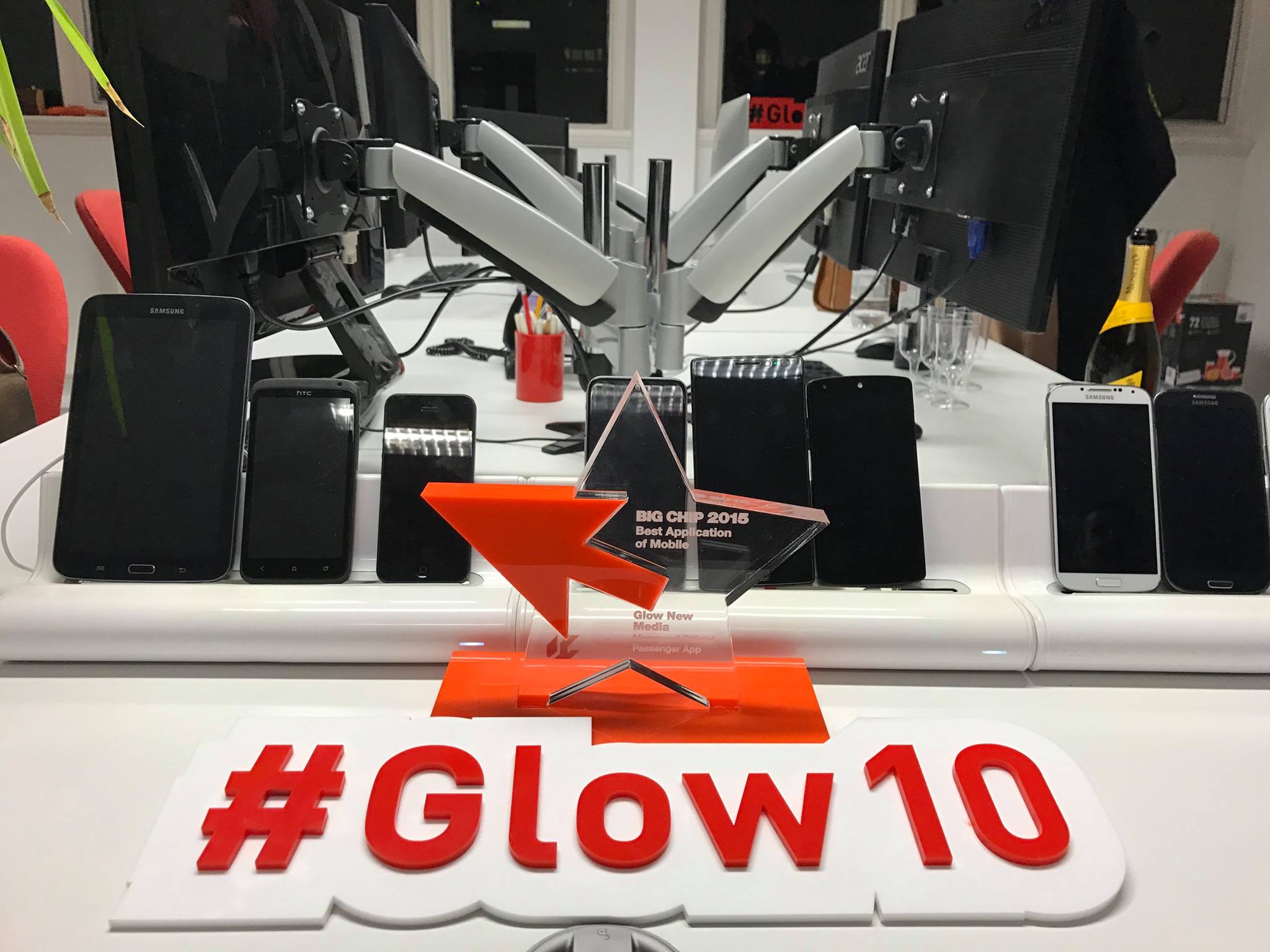 Glow10 sign with a Big Chip award