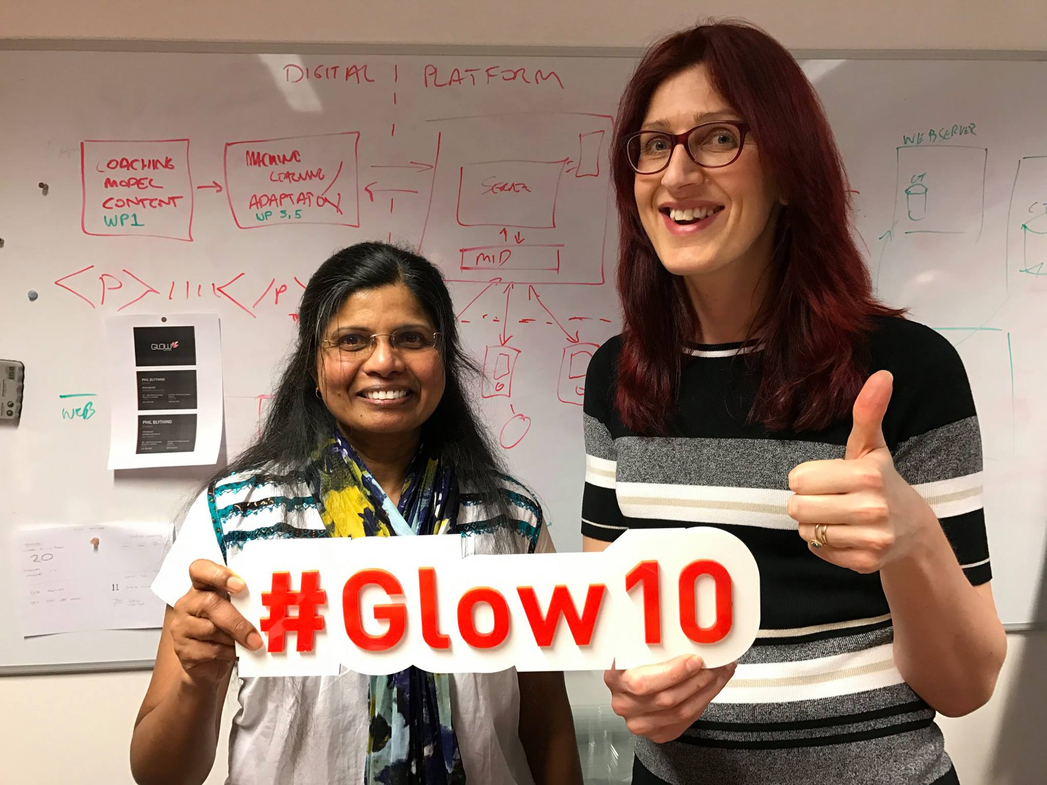 People with a Glow10 sign