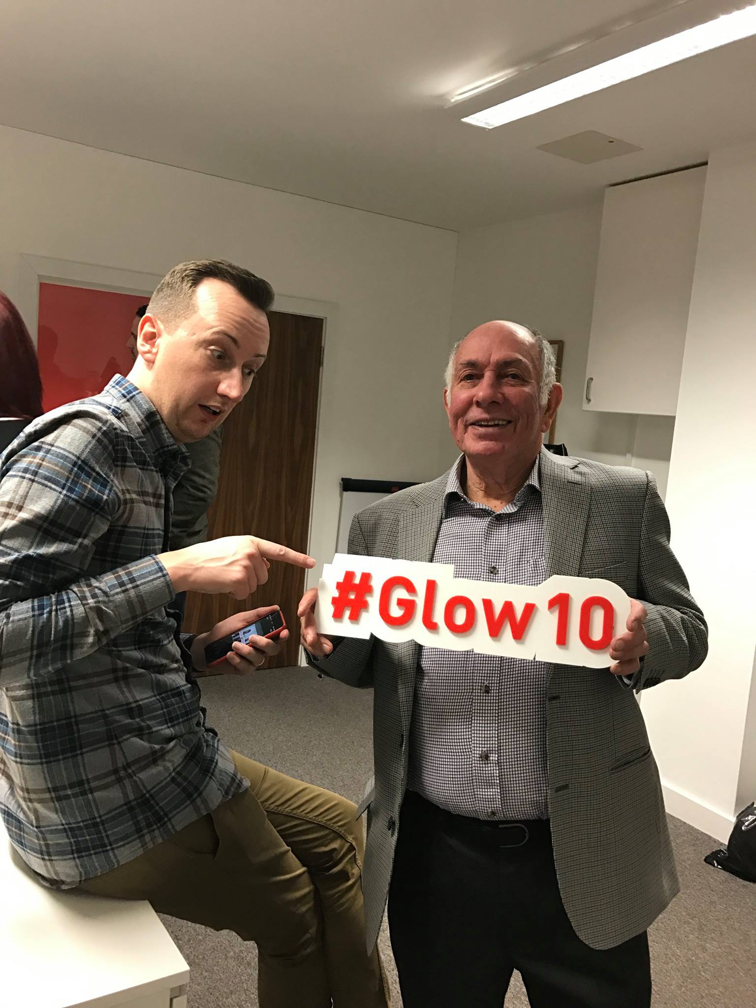 People with a glow10 sign